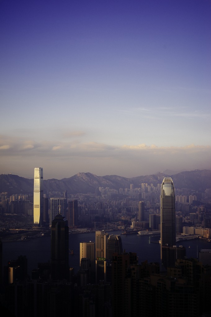 Speck of Plane over Vertical Hong Kong