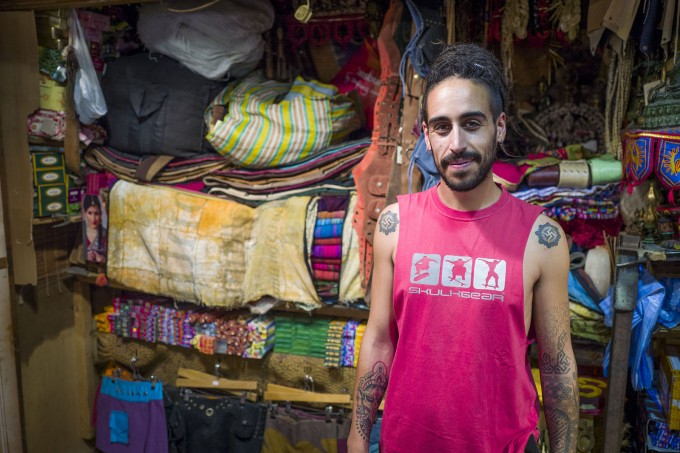 Man in rug shop colour